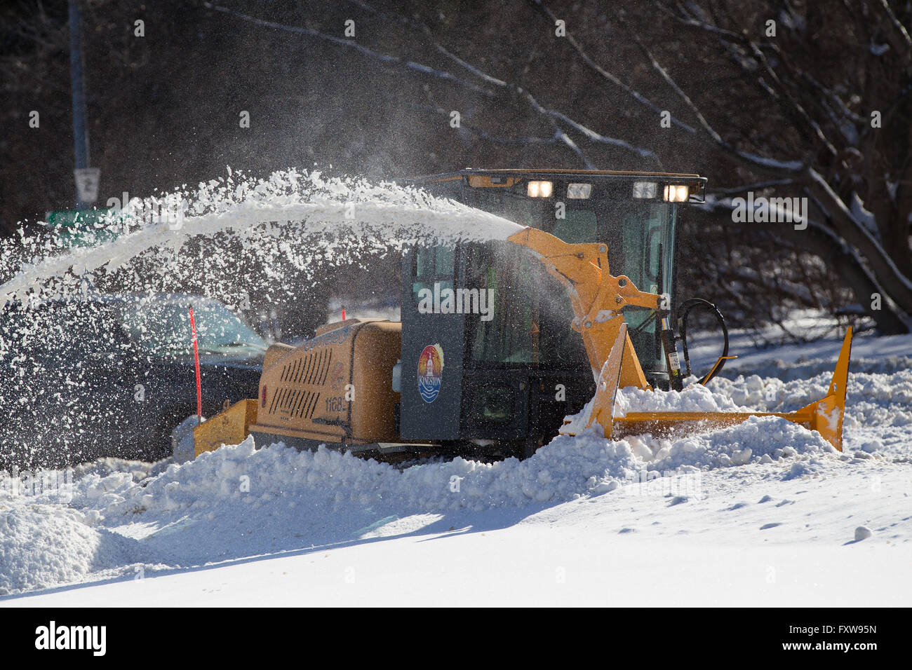 A snow plow clears a sidewalk in Kingston, Ont., on Thursday Feb. 18