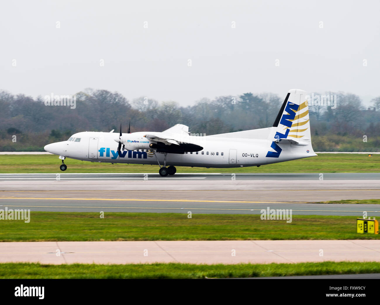 VLM Airlines Fokker 50 Turboprop Airliner OO-VLQ Landing at Manchester ...