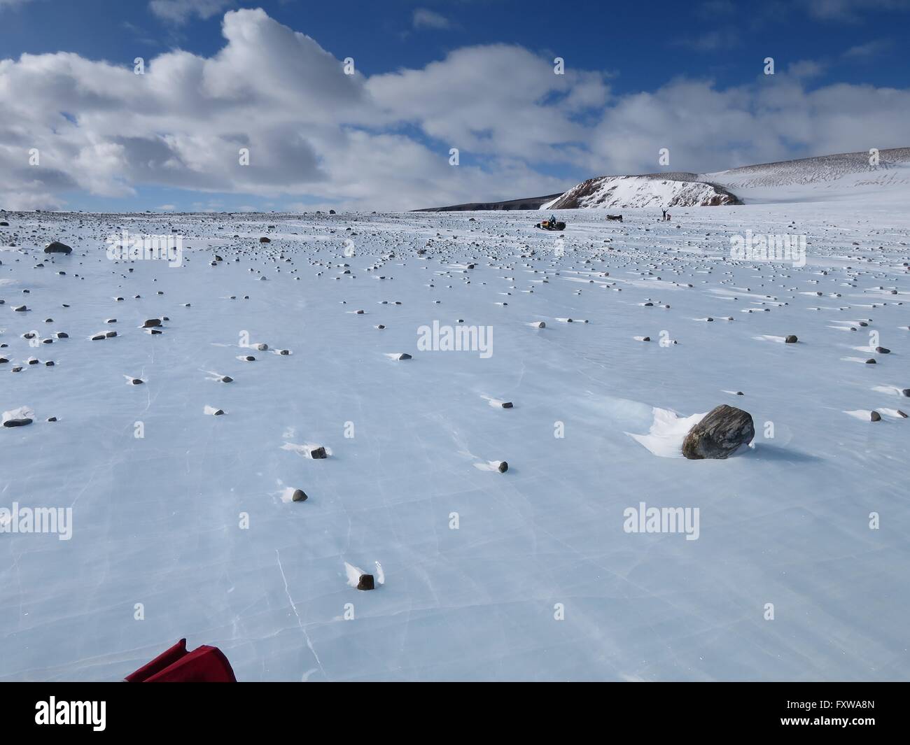 Meteorites widely scattered across a moraine on the blue ice field in the Miller Range December 19, 2015 in Antarctica. Scientists collected 570 meteorite samples during a two-month expedition as part of the Antarctic Search for Meteorites program. Stock Photo