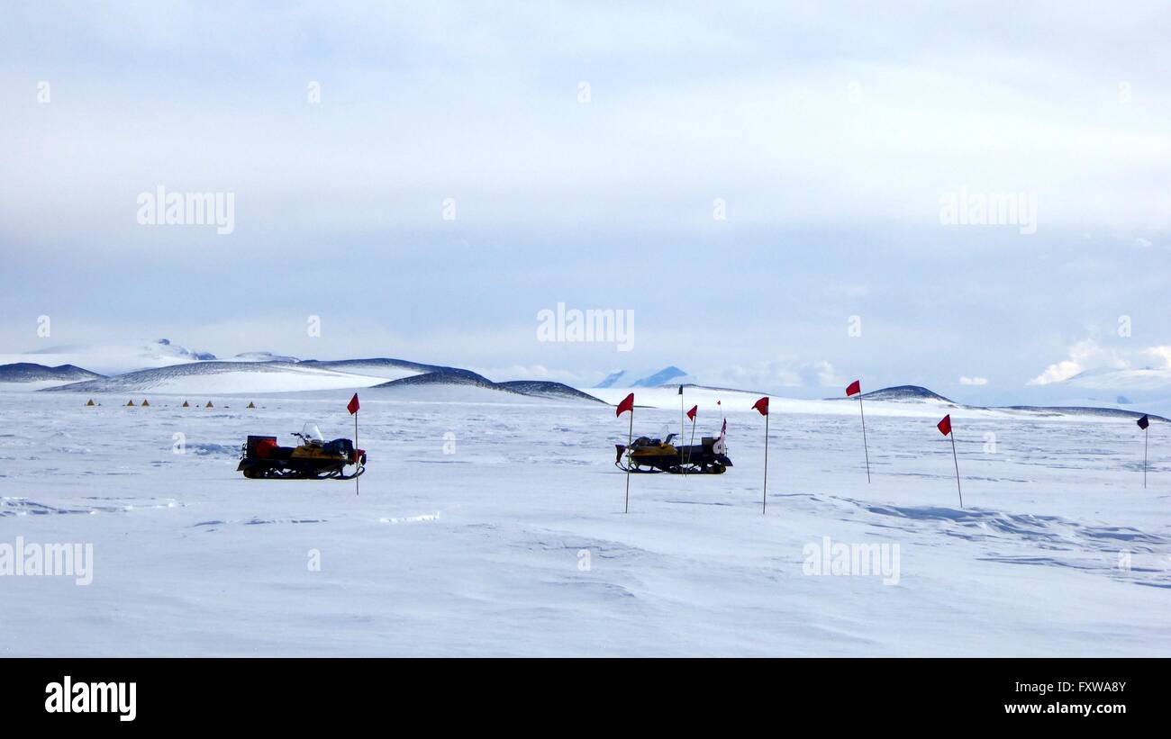 Researchers spread out across the blue ice field in the Miller Range in search of meteorites December 24, 2015 in Antarctica. Scientists collected 570 meteorite samples during a two-month expedition as part of the Antarctic Search for Meteorites program. Stock Photo