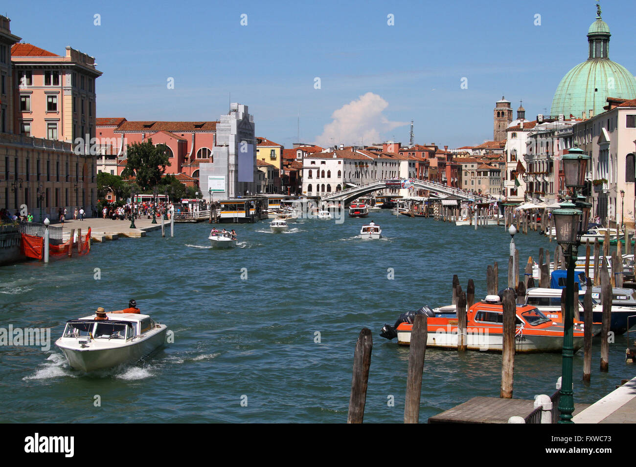 BOATS ON GRAND CANAL NEAR PIAZZALE ROMA VENICE VENEZIA ITALY 01 August 2014 Stock Photo