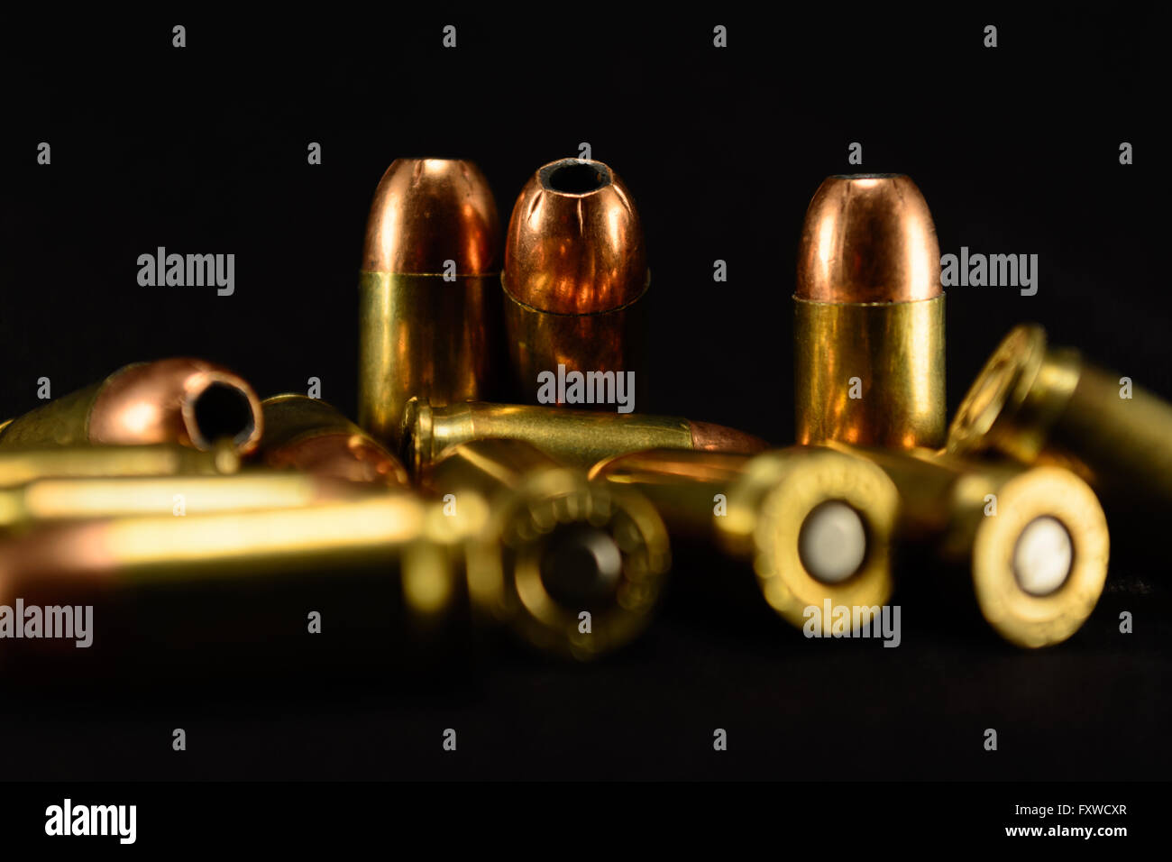 380 Auto bullets on black counter, black background, selective focus background Stock Photo