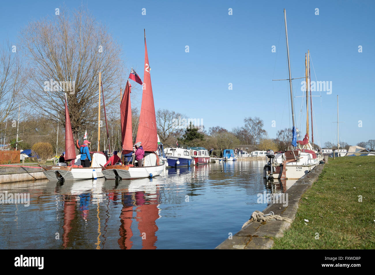 Two traditional clinker hulled sailing dinghies prepare to sail on Hickling Broad, Norfolk, England, UK Stock Photo