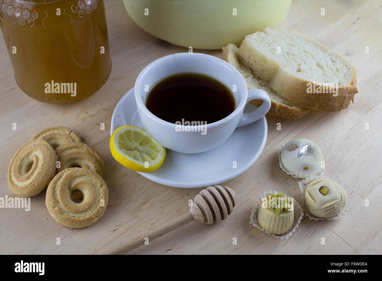 A Cup On English Tea With Honey On The Background And Small Sweets As Dessert For Relaxing Tea Time Moment Stock Photo Alamy