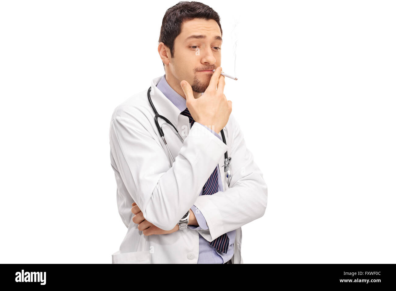 Careless doctor smoking a cigarette isolated on white background Stock Photo