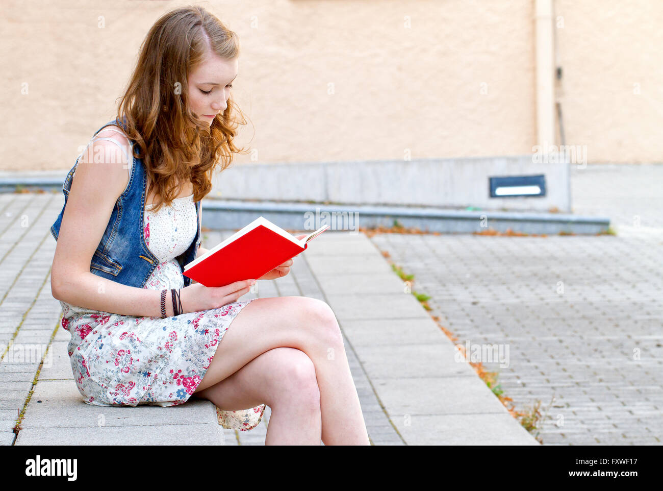 Young woman reading a book Stock Photo