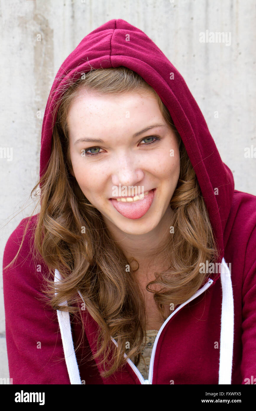 Teenager sticking tongue out Stock Photo