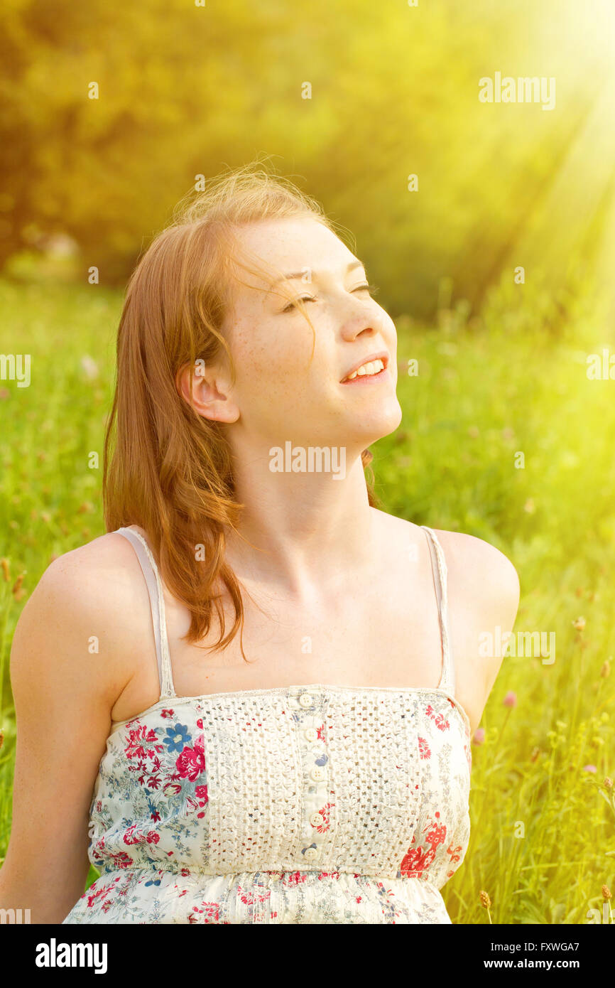 Young woman enjoy the warm sun Stock Photo