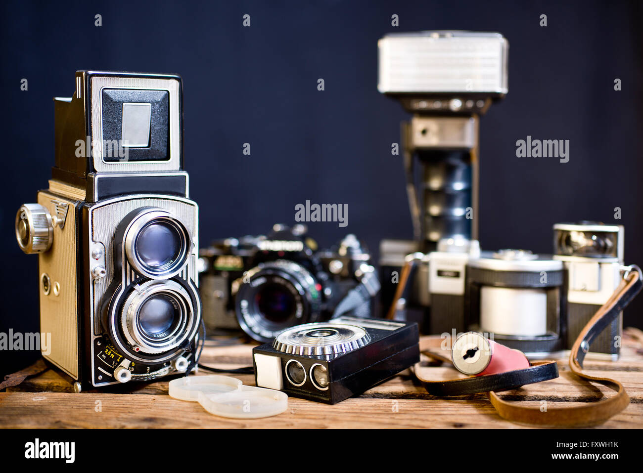 old analogue photographic cameras on the dark background Stock Photo