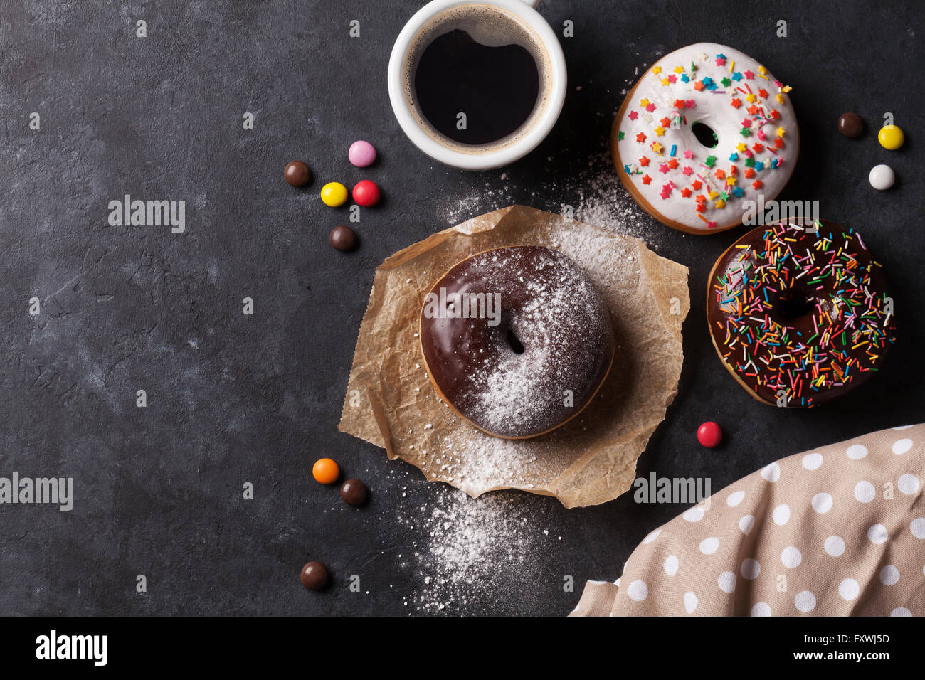 Donuts and coffee on stone table. Top view with copy space Stock Photo ...
