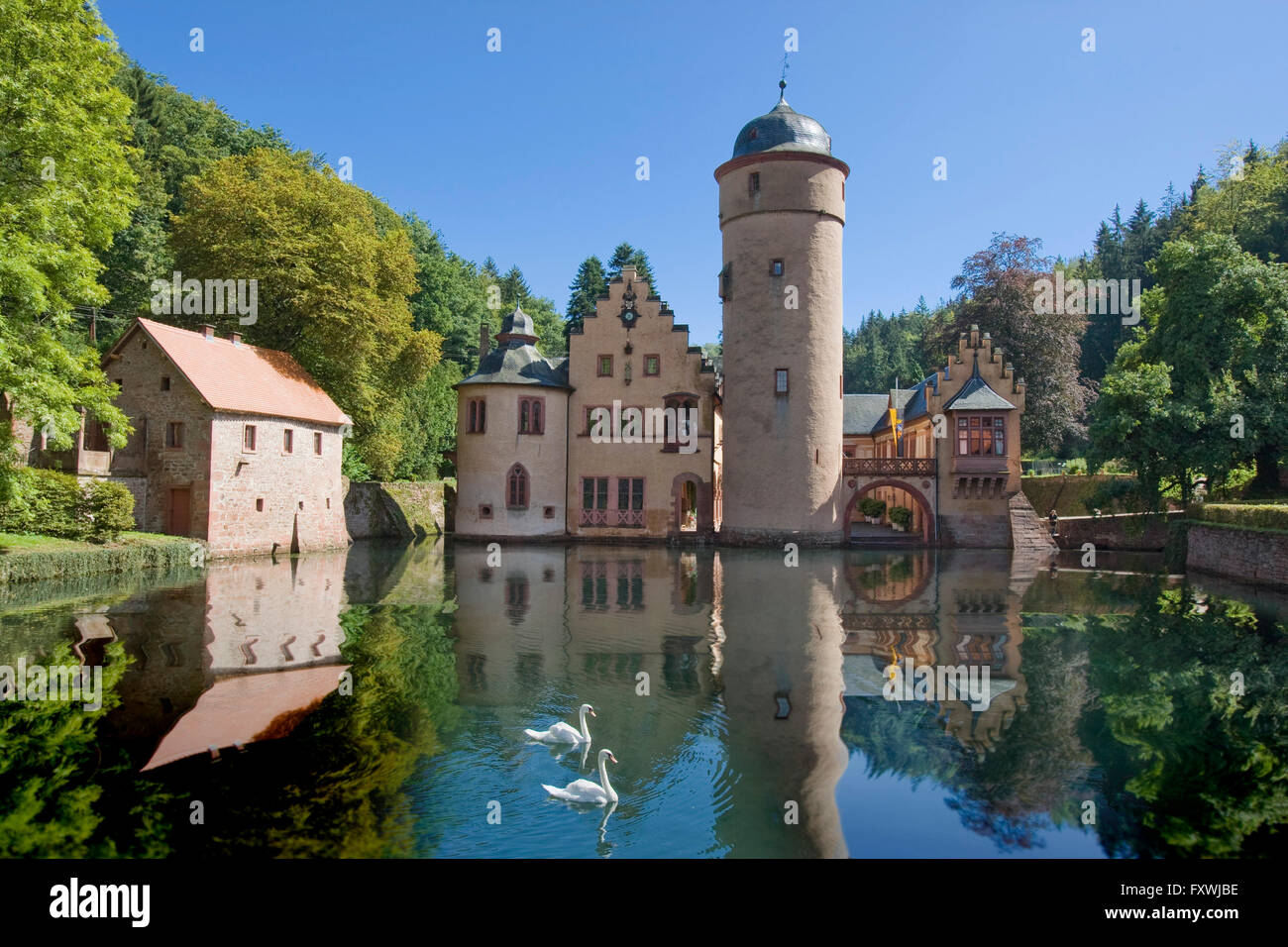 The moated castle Mespelbrunn lies in an isolated side valley of the Elsava valley in the Spessart, Bavaria, Germany. Stock Photo