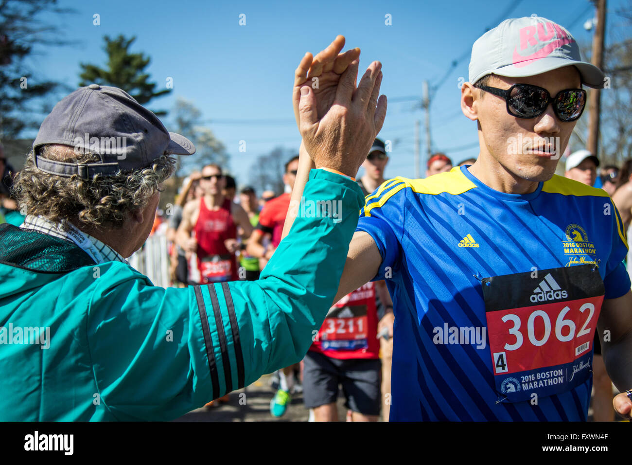 Hopkinton, MA, USA. 18th April, 2016. Moments after the starting gun, the Elite Men and Wave 1 fields embark upon the course into Boston. John Kavouris/Alamy Live News. Stock Photo