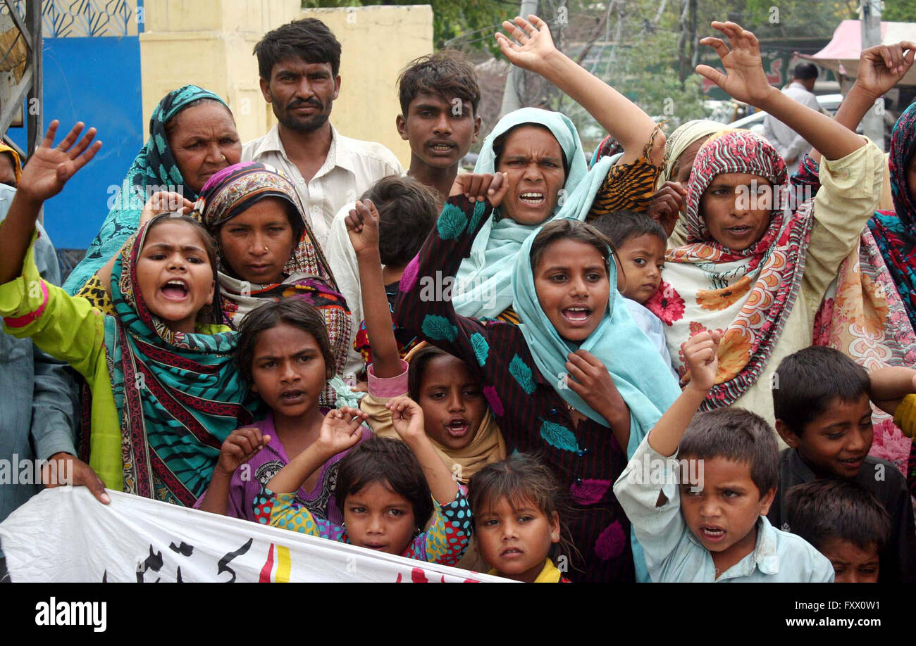 Residents of District Okara chant slogans against high handedness of influent people during protest demonstration at Lahore press club on Tuesday, April 19, 2016. Stock Photo