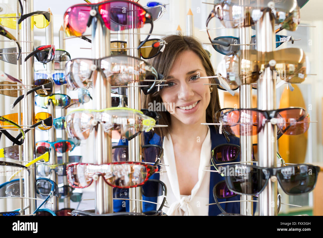 View through eyeglasses display of woman looking at camera smiling ...