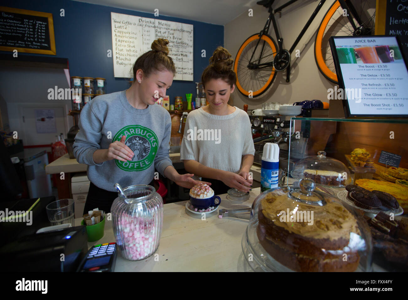 Teenage girls working in a coffee shop Stock Photo Alamy
