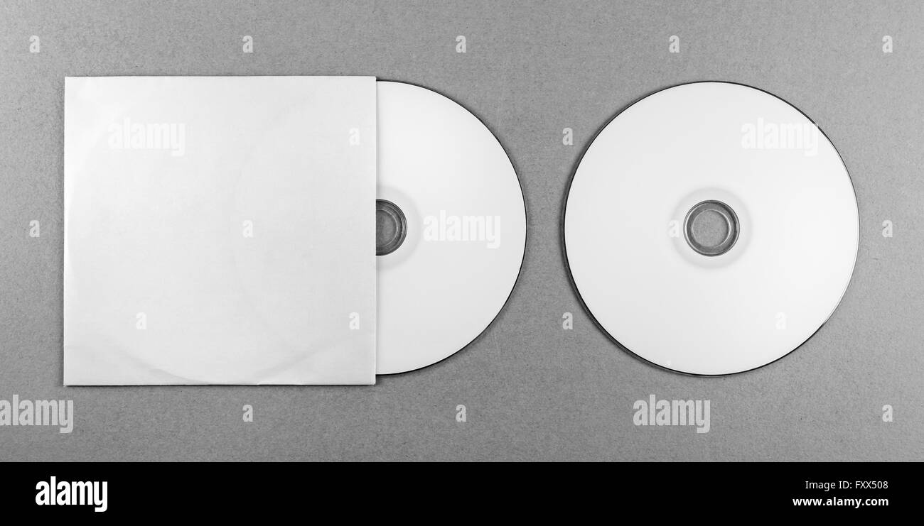 Blank CD on gray background. Mock-up for design presentations and portfolios. Top view. Grayscale image. Stock Photo