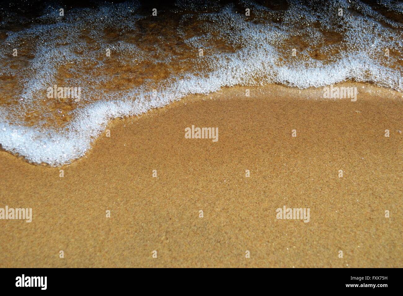 Bubbly waves on the beach of Lake Huron Stock Photo