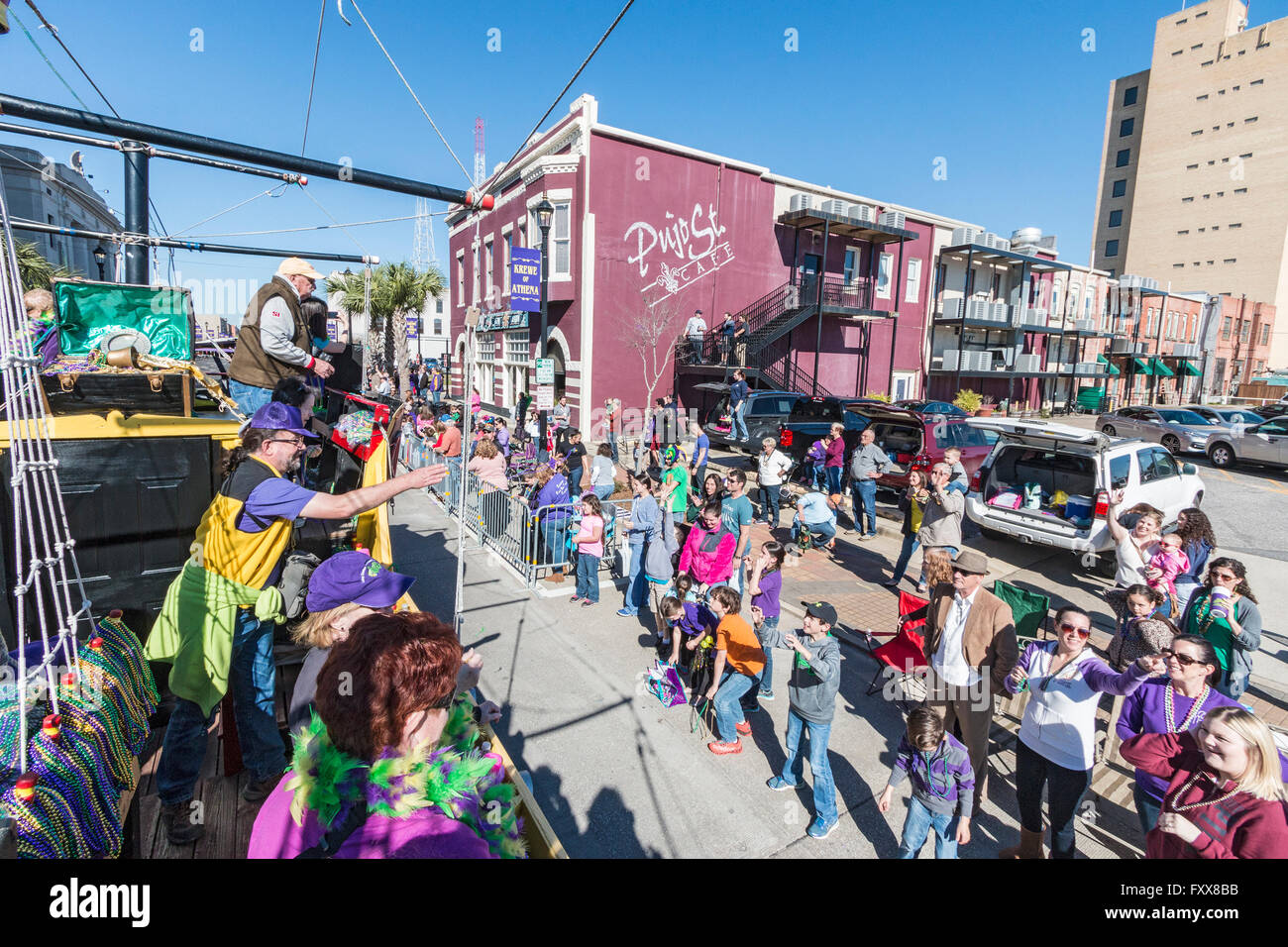 Tossing beads to the crowd from pirate float during the children's parade of the family friendly Mardi Gras in Lake Charles, LA. Stock Photo