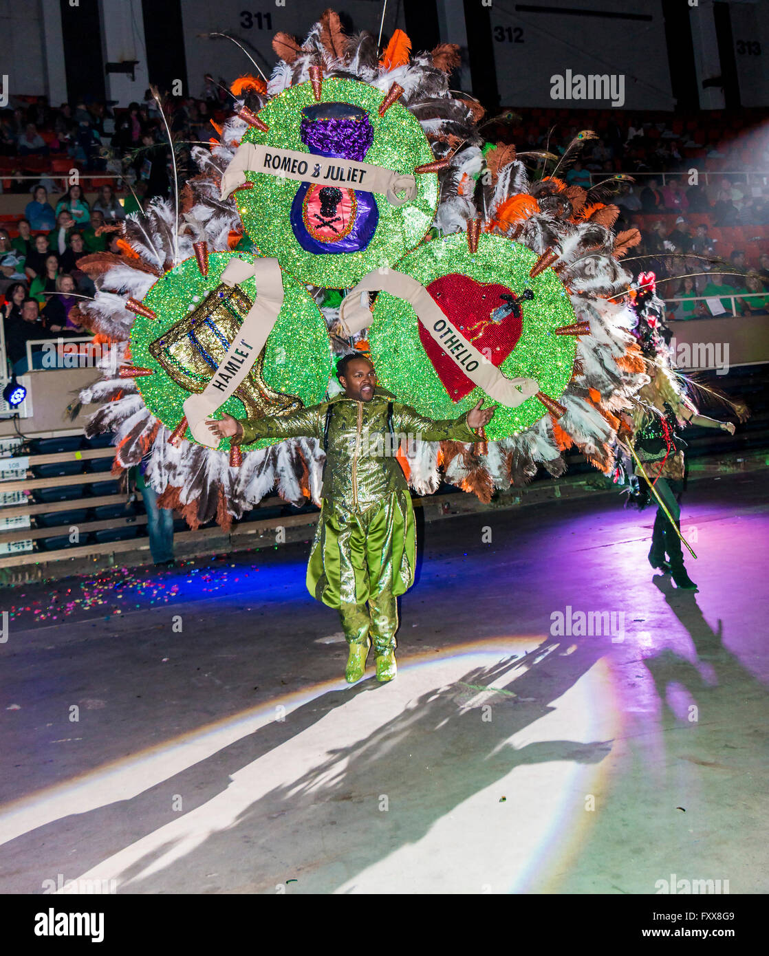 Revelers march in the parade of Krewes in the Lake Charles Civic Center