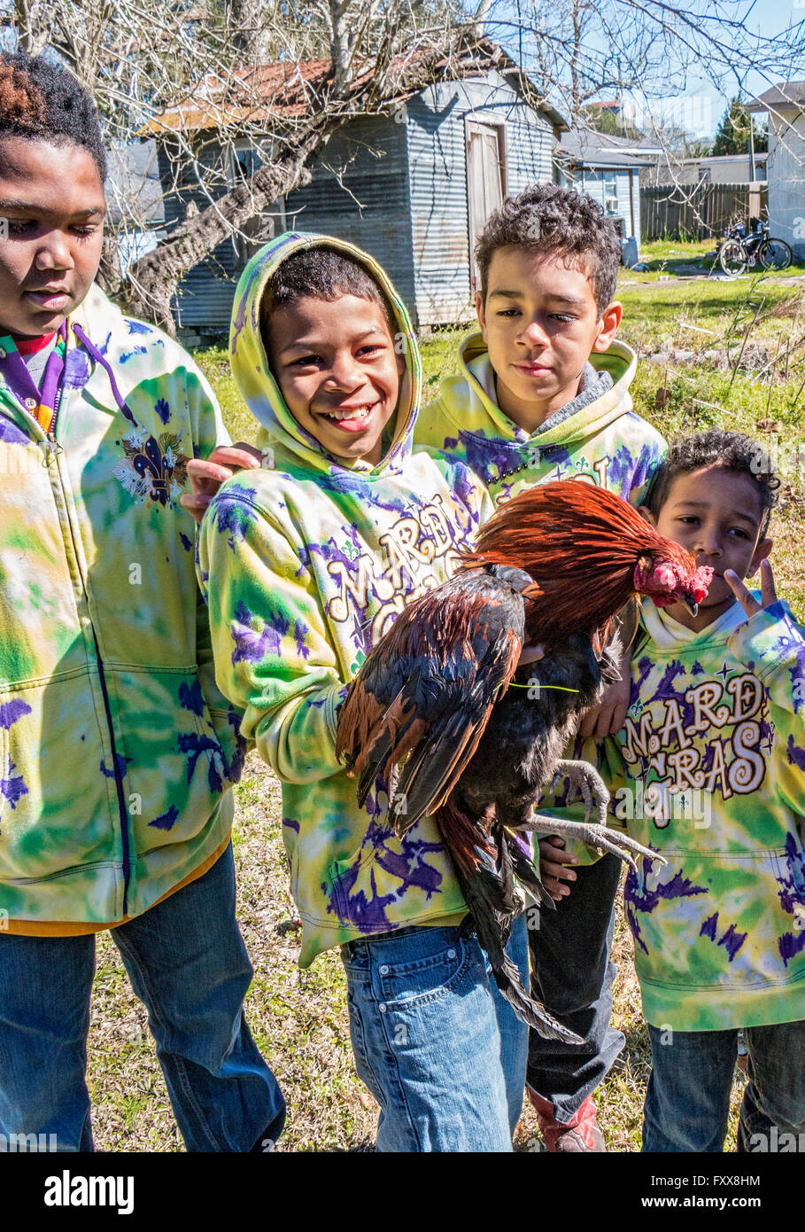 Victorious young boy chicken catcher during the traditional Chicken Run