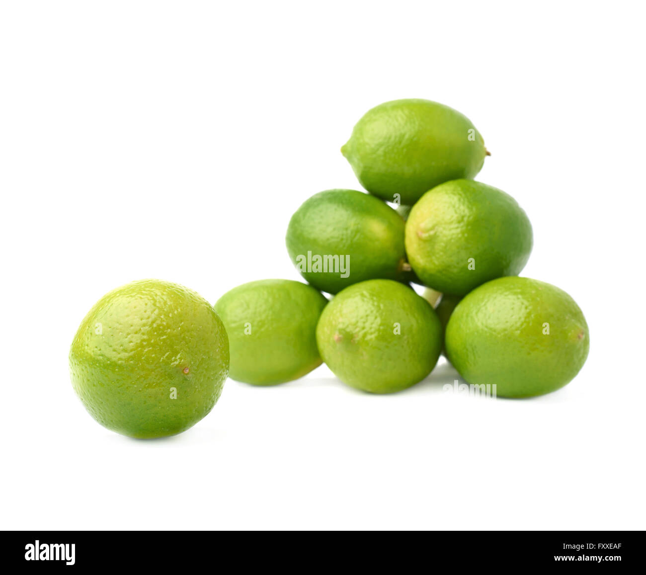 Pile of multiple ripe limes, composition isolated over the white ...
