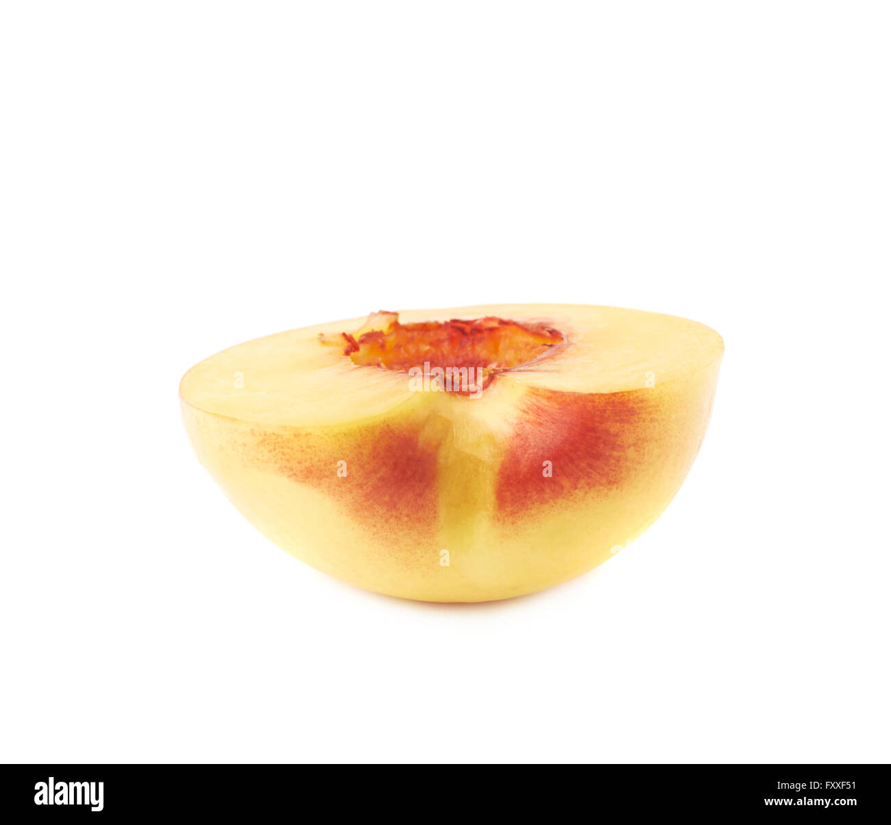 Cut open nectarine half isolated Stock Photo Alamy