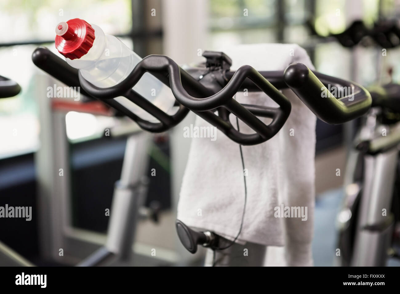 Bottle of water and napkin on exercise bike Stock Photo Alamy