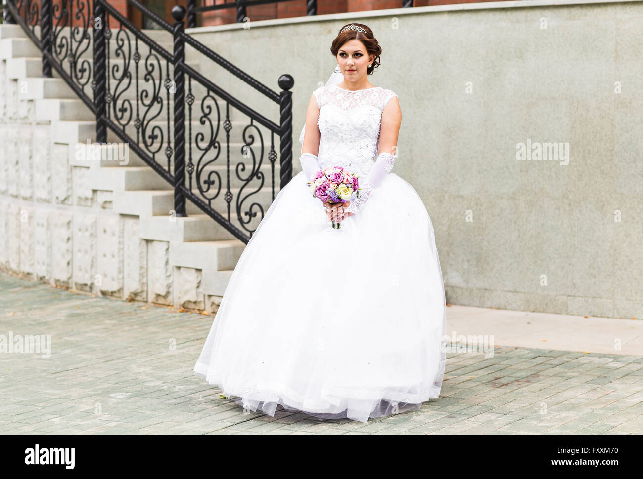 Beautiful wedding bouquet in hands of the bride Stock Photo - Alamy