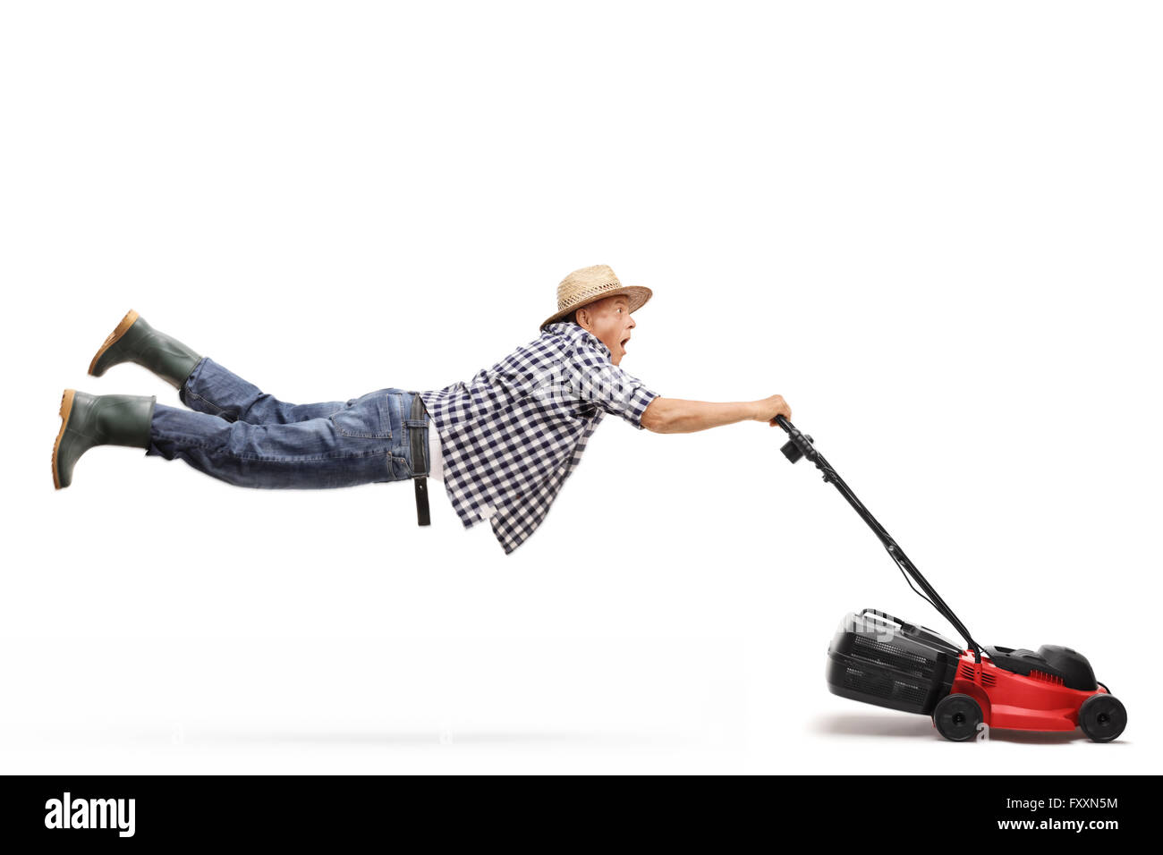Mature gardener being pulled by a powerful lawn-mower isolated on white background Stock Photo
