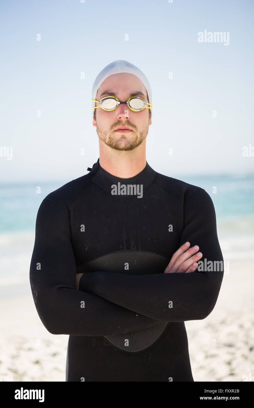 Handsome man wearing swimming cap and goggles Stock Photo