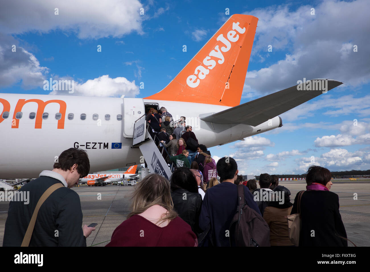 Passengers boarding an Easyjet flight at Gatwick airport Surrey UK