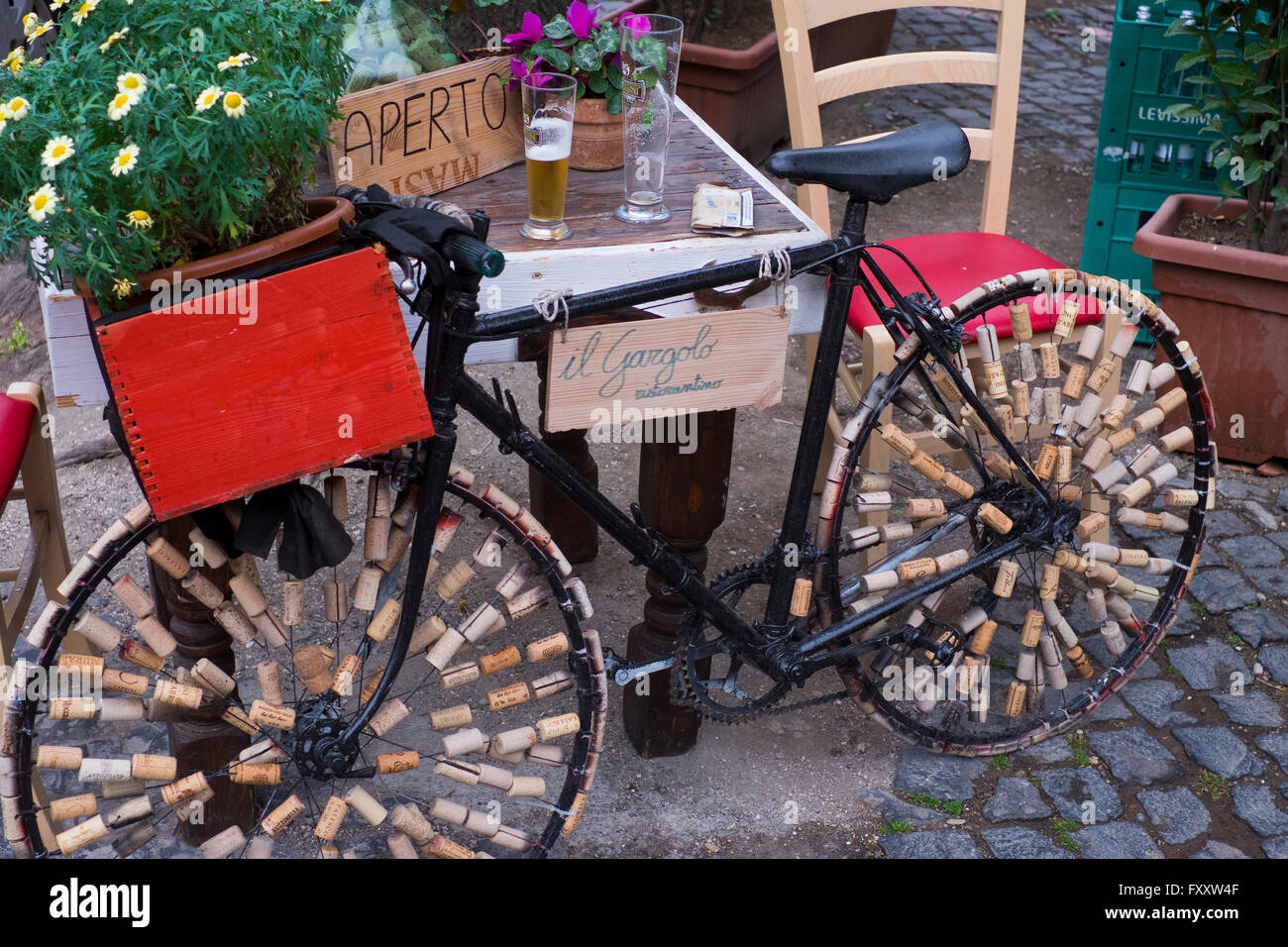 Bicycle covered in wine corks outside wine bar in Viterbo Italy Stock