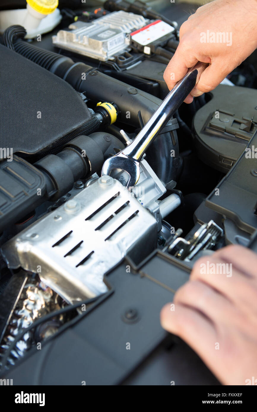 Mechanic Holding Spanner Fixing Car Engine Stock Photo Alamy
