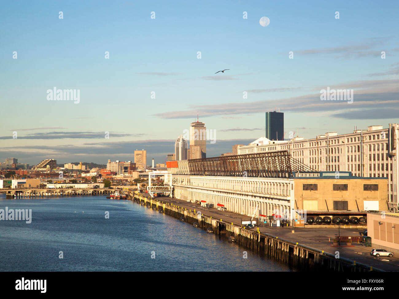 Early morning view of cruise ship port with the full Moon in a
