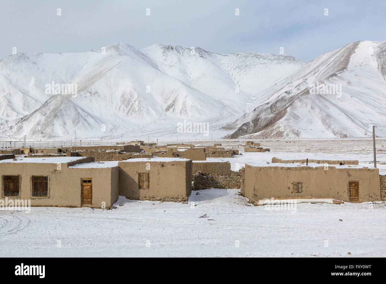 Winter view of a village in the high mountains of the Pamirs Stock Photo