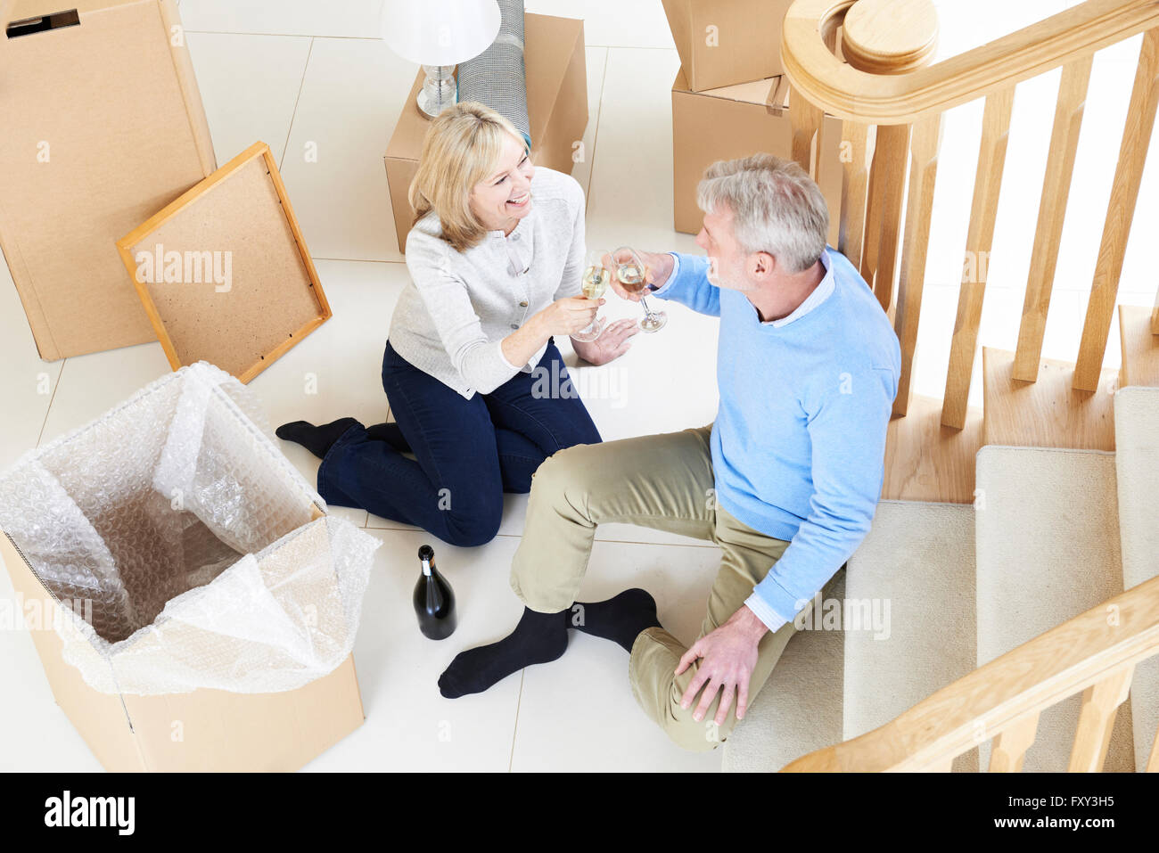 Celebrating home couple hi-res stock photography and images - Alamy