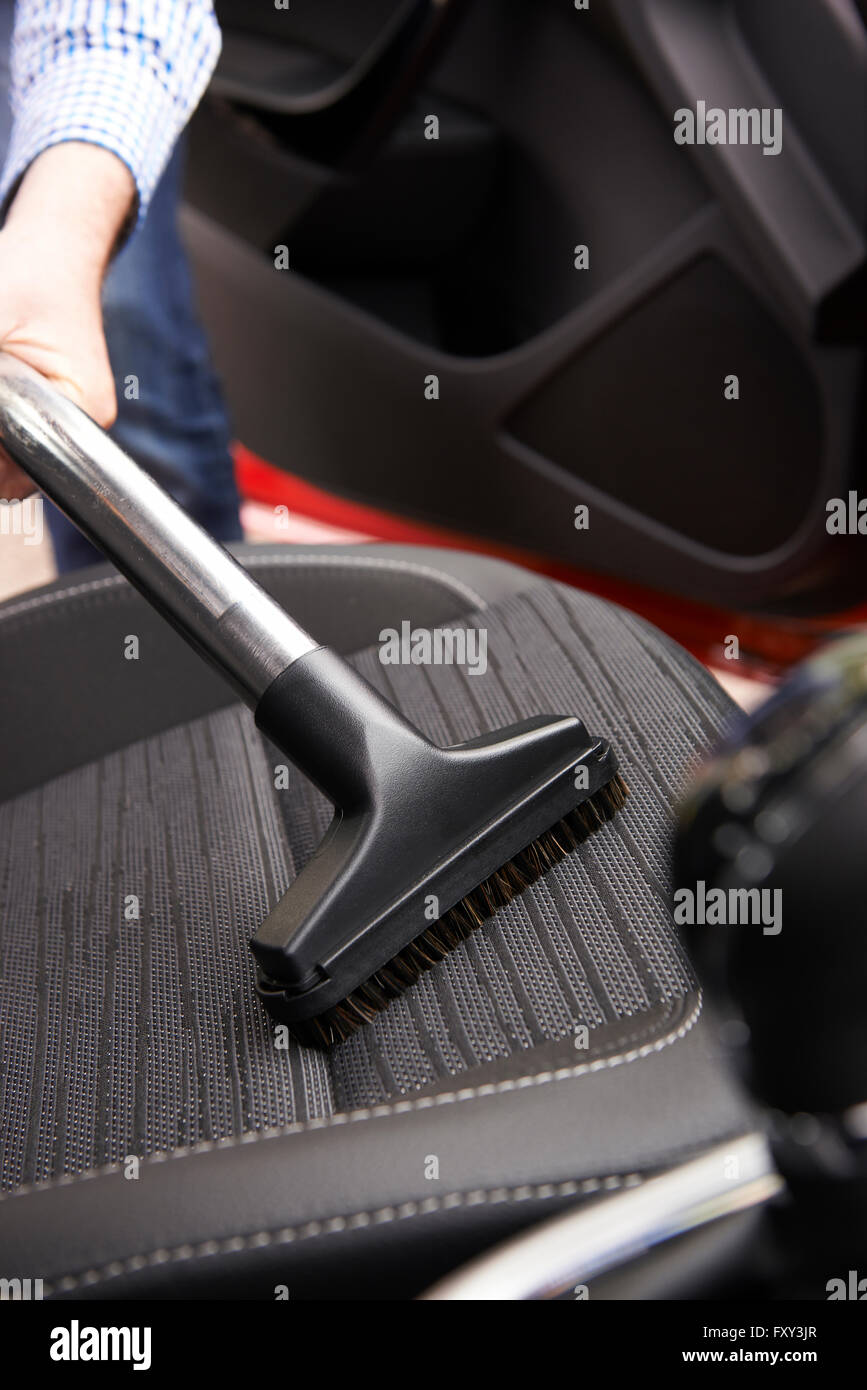 Man Hoovering Seat Of Car During Car Cleaning Stock Photo Alamy