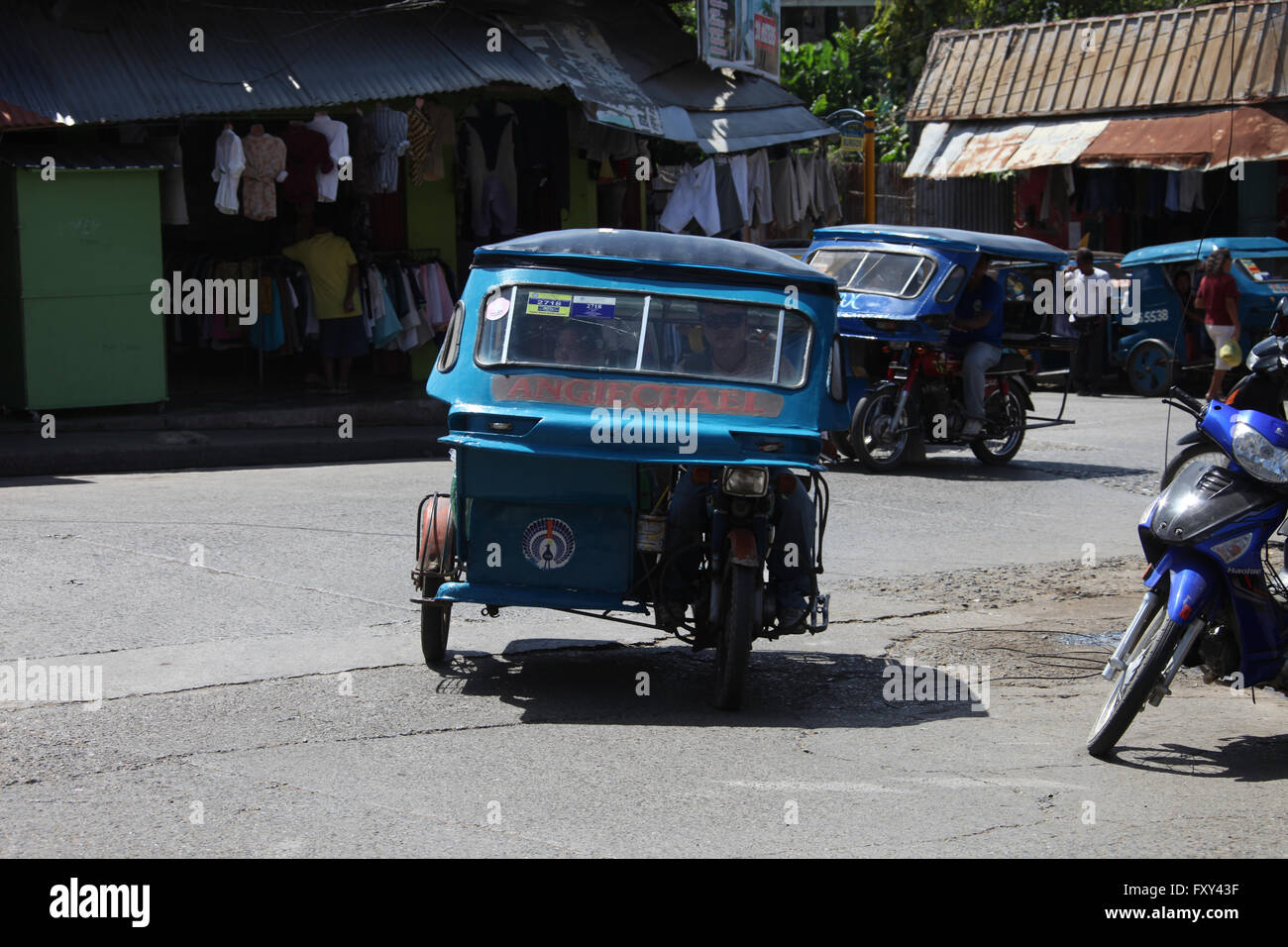 BLUE TRIKES ON STREET PUERTO PRINCESA PHILIPPINES ASIA 23 April 2015 Stock Photo