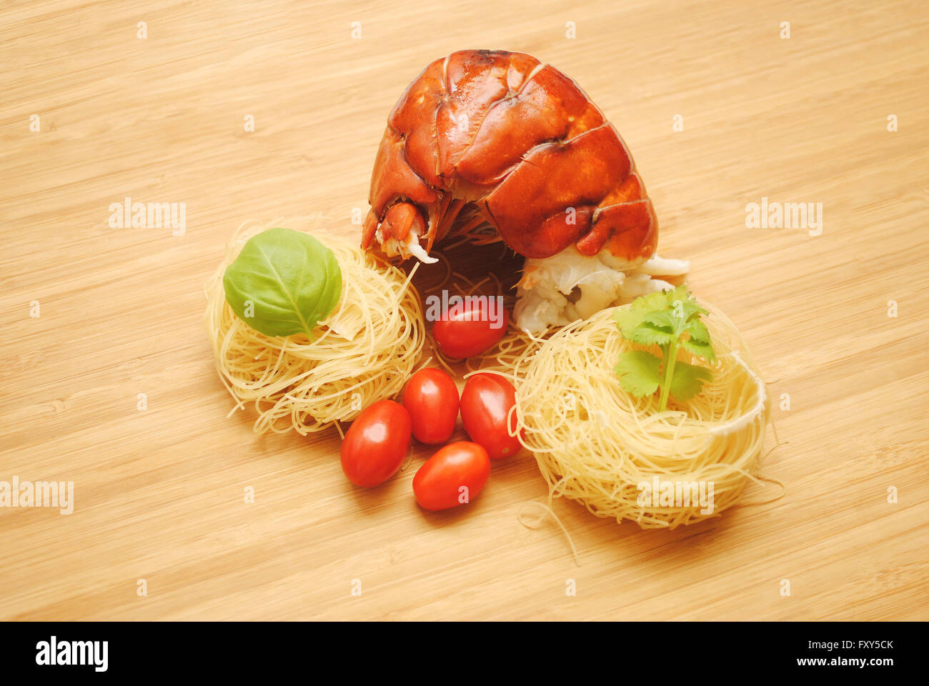 Fresh Lobster Tail with Dried Angel Hair Pasta Nests Stock Photo
