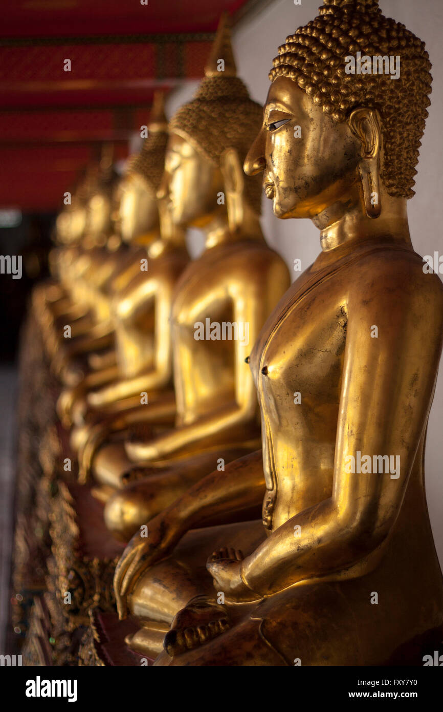 Golden Budha statues in the Pho Temple in Bangkok Thailand Stock Photo