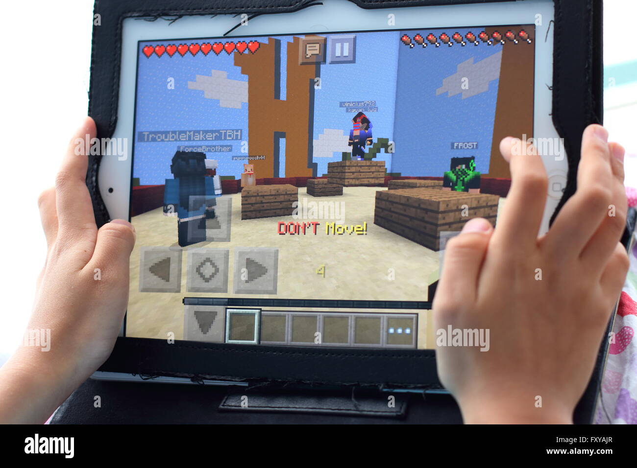 Teenager playing Minecraft multiplayer online game (MMO Stock Photo - Alamy