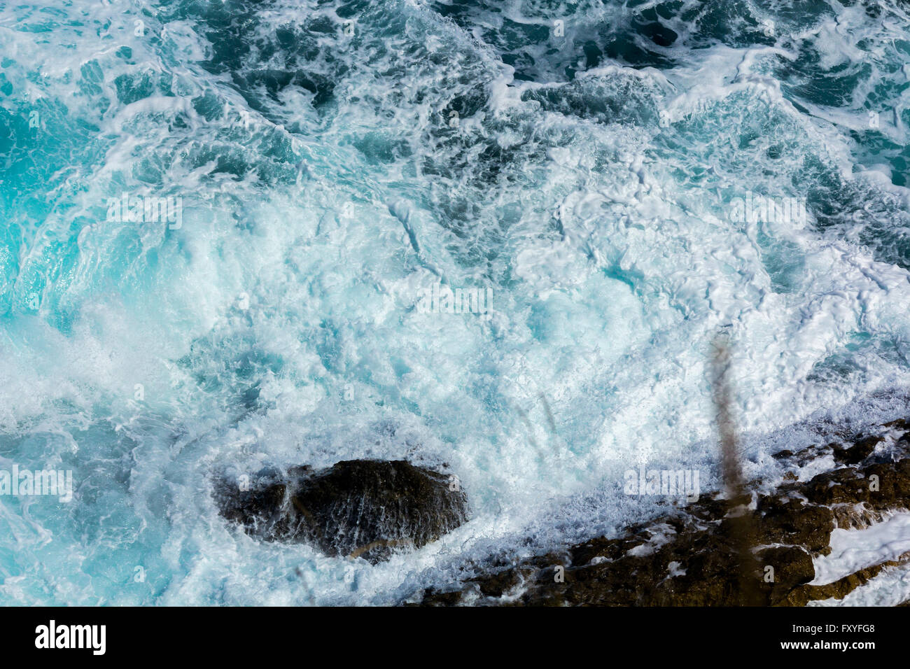 ocean waves crashing on the rocks with white foam Stock Photo - Alamy