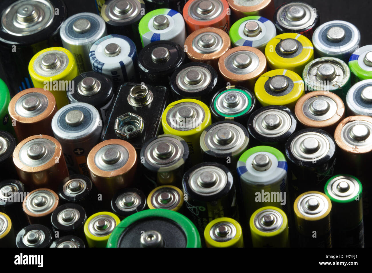 Batteries of different types and colors Stock Photo
