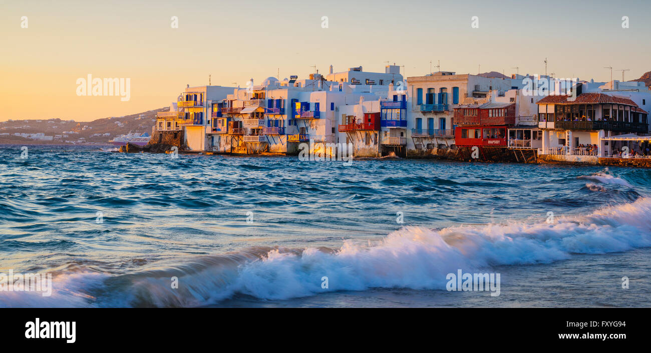 Rolling waves and sunset dining at famous Mykonos neighborhood of Little Venice, Mykonos, Greece Stock Photo