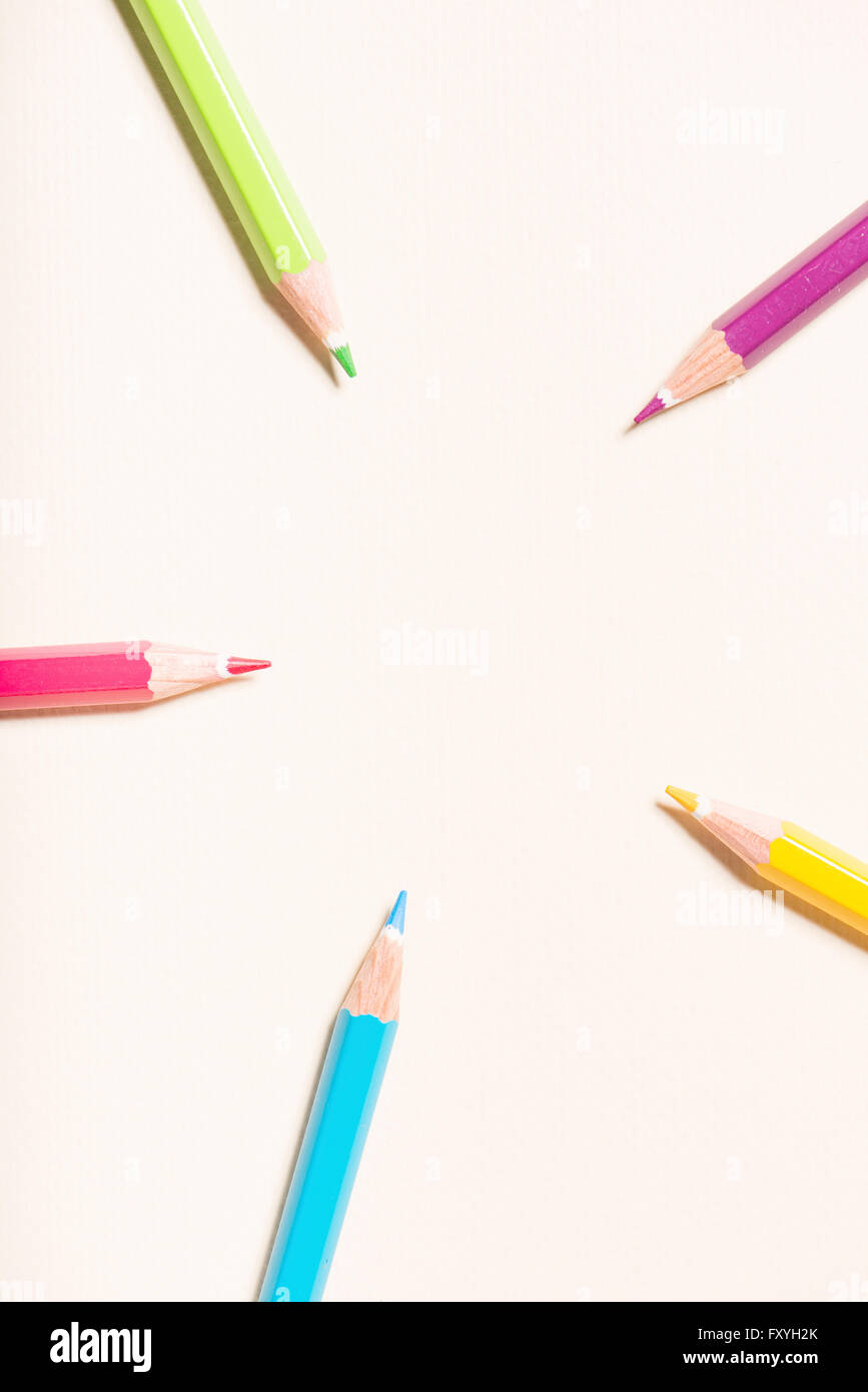 Color pencils in a circle, pointing towards the center Stock Photo