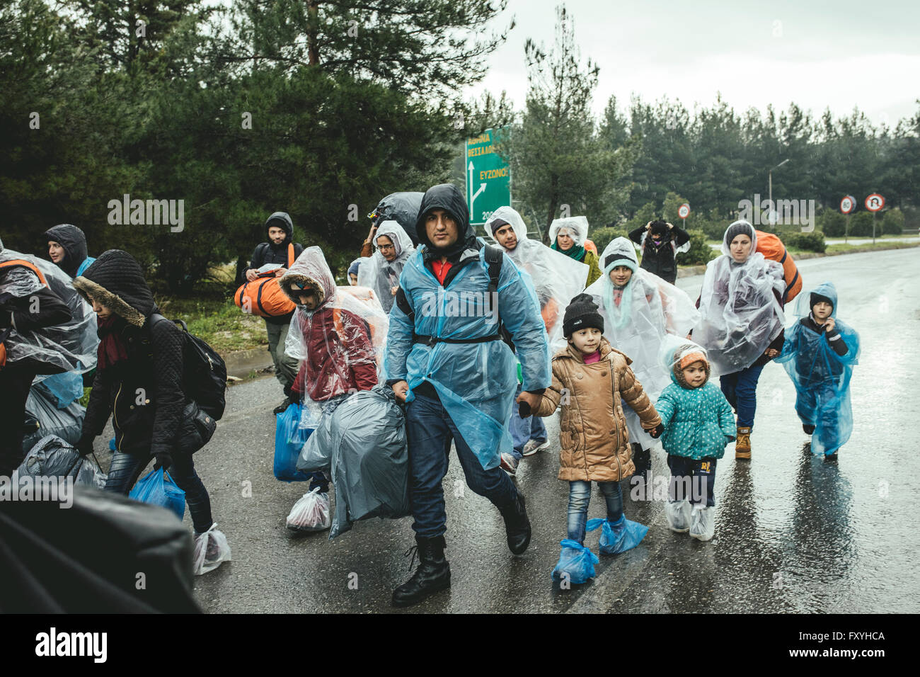 Incoming refugees in rain, refugee camp in Idomeni, border with Macedonia, Greece Stock Photo