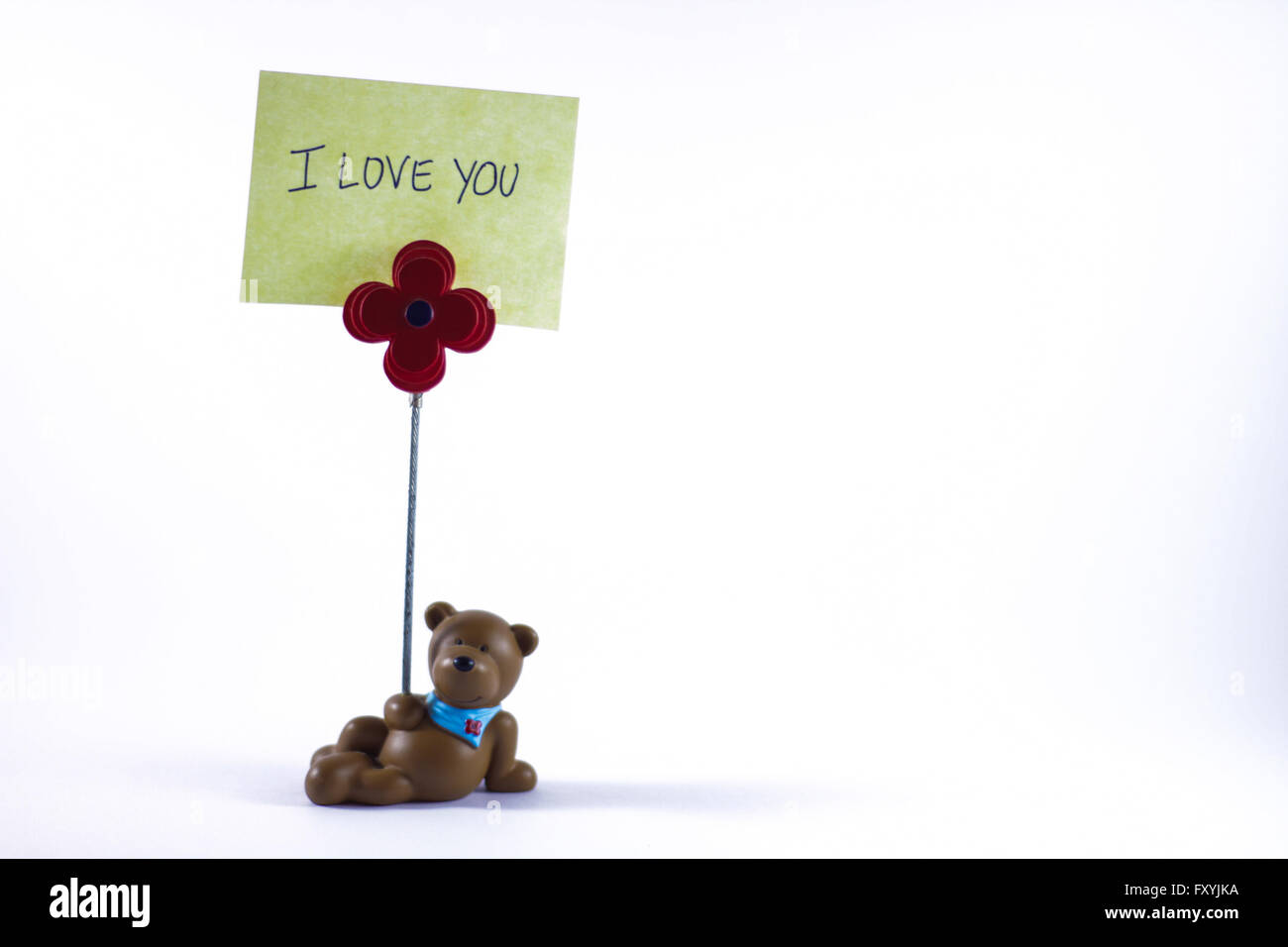 Teddy bear with a I Love You sign in a white background Stock Photo - Alamy