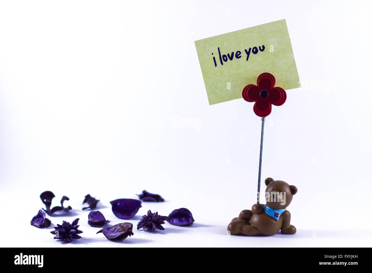 Teddy bear with a I Love You sign in a white background Stock Photo