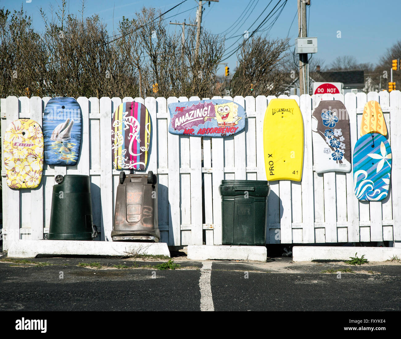 Boogie boards on a fence in New Jersey Stock Photo