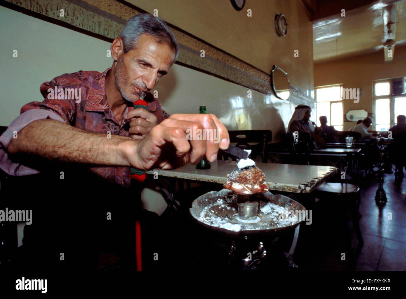 Cafe 'Arab League'. Jordanian Arabs in cafe smoking Nargileh pipes Amman Jordan. Stock Photo